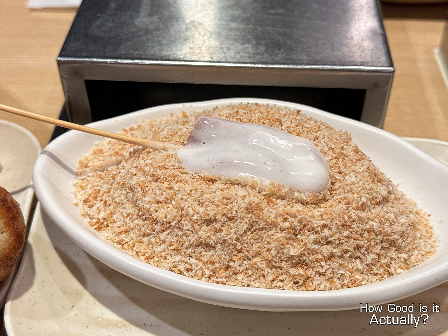 Kushiya Monogatari Dipping Skewer into Breadcrumbs Mixture